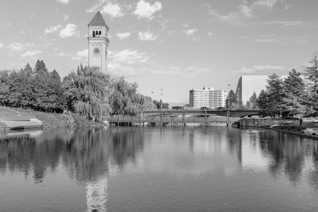 Riverfront Park in Spokane, with the Great Northern clock tower reflected in the river